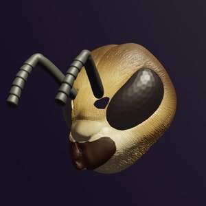 May include: A close-up of a bee head with large, dark eyes and two antennae. The bee is made of a light brown material and has a textured surface.