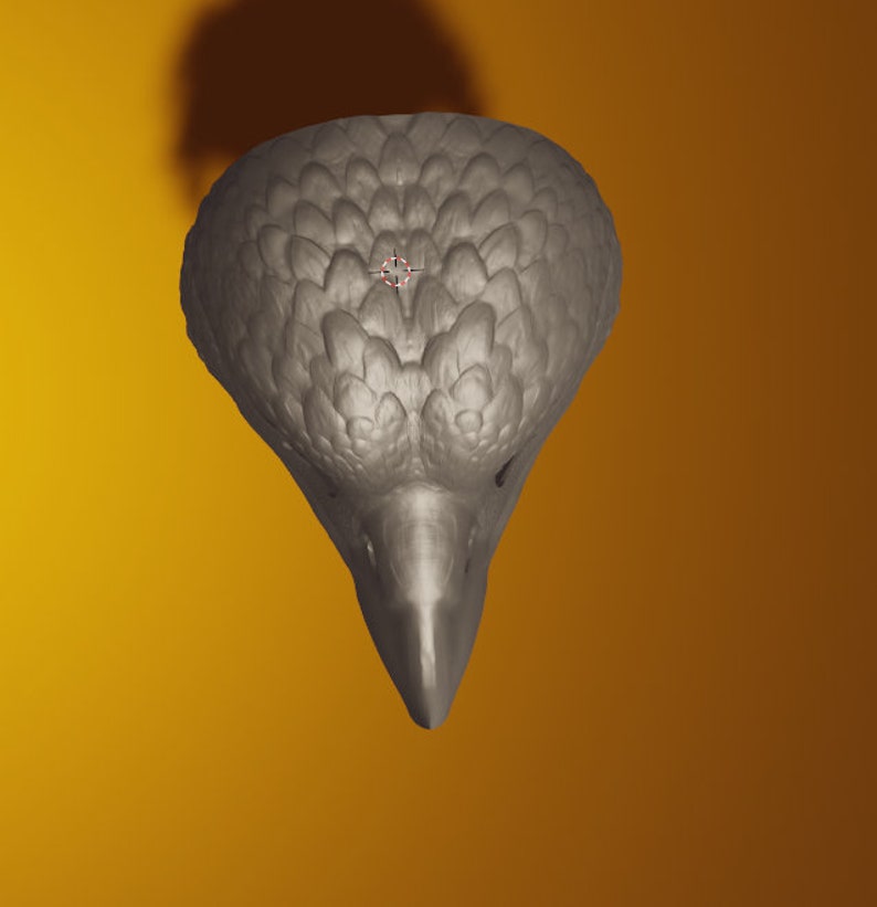 May include: A gray ceramic bird sculpture with a detailed textured surface. The bird's head is tilted down and its beak is pointed.