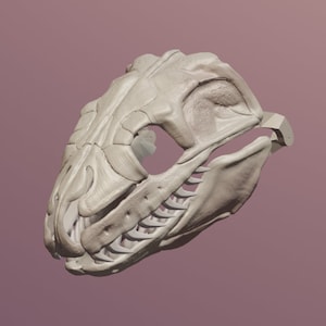May include: A detailed 3D printed model of a skull with sharp teeth, resembling a prehistoric creature. The skull is white and has a textured surface.