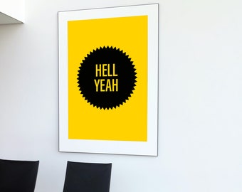 May include: A framed print with a yellow background and a black starburst shape with the text "HELL YEAH" in white letters.