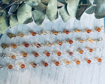 Pulsera de cornalina hecha a mano: cristal envuelto en alambre de oro y plata