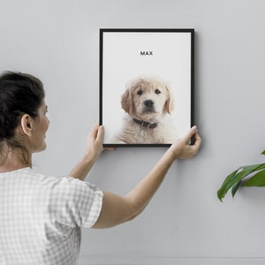 May include: A framed print of a golden retriever puppy with the name "Max" printed above the image.
