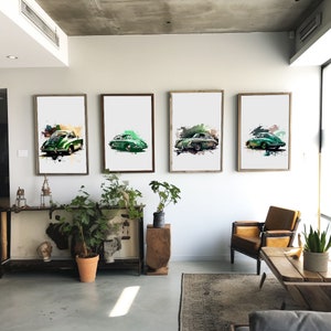 May include: Four framed watercolor paintings of green vintage cars on a white wall. The cars are all different models and have a faded, vintage look. The paintings are all framed in black frames.