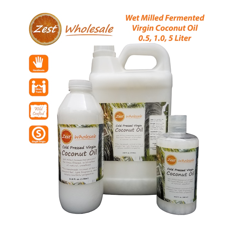 May include: Three white bottles of Zest Wholesale Cold Pressed Virgin Coconut Oil. The bottles are labeled with text and a logo. The sizes are 0.5, 1.0, and 5 liters. The image also includes icons for handmade, direct trade, wild crafted, and single origin.