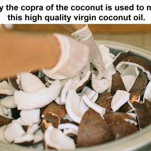May include: A close-up of a metal bowl filled with coconut pieces. The coconut pieces are brown and white. A gloved hand is reaching into the bowl. Text at the top reads: "Only the copra of the coconut is used to make this high quality virgin coconut oil."