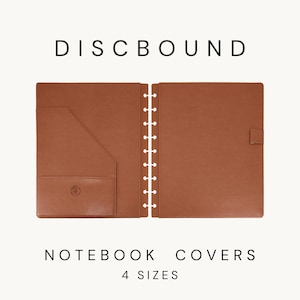 May include: A tan discbound notebook cover set featuring a left panel with an interior pocket and a right panel with a pen loop. The text DISCBOUND NOTEBOOK COVERS 4 SIZES is displayed. The left pocket features a small circular embossed logo.