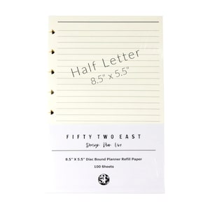 May include: A pack of 100 sheets of cream-colored, disc-bound planner refill paper measuring 8.5 inches by 5.5 inches. The paper features horizontal lines and a left-hand margin with disc-binding slots. The packaging is labeled Fifty Two East.