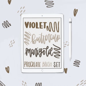 May include: A white iPad with a brown and black brush set for Procreate. The text on the screen reads "VIOLET, BUTTERCUP, MARIGOLD, PROCREATE BRUSH SET".