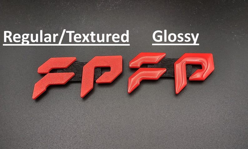 May include: Image shows two sets of red, stylized letters "FP" with different finishes. The left set has a textured appearance, while the right set is glossy. The text "Regular/Textured" and "Glossy" are above the respective sets.