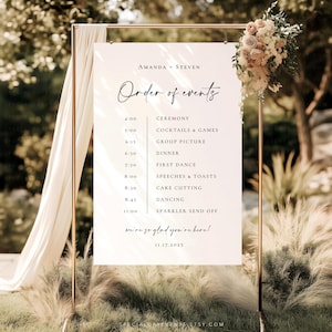 May include: A wedding event sign with the text "AMANDA + STEVEN" and "Order of events". The sign lists the ceremony, cocktails, dinner, first dance, speeches, cake cutting, dancing, and sparkler send off. The sign is decorated with flowers.