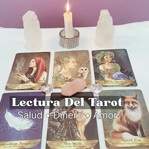 May include: A tarot card reading setup featuring several tarot cards with illustrations, crystals, a lit candle, and two selenite towers. The cards display images of women, animals, and symbols. The text "Lectura Del Tarot" is visible.