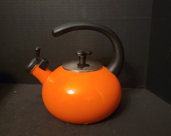 Vintage Rachael Ray Whistling Teakettle 1.5 Qt Orange Enamel Kettle Black Hook Handle. 6" across bottom.