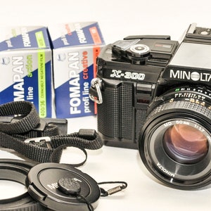 MINOLTA x300 - black - with 50 mm f/1.7 MD lens and three fomapan b&w films 100/200/400iso 36 frames - EXCELLENT.