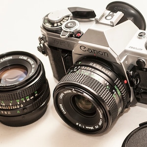 Canon AE-1 film camera with lenses 50 mm f/1.8 and 28 mm f/2.8 - EXCELLENT.