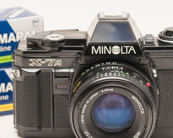 MINOLTA X-7A 35 mm film camera - like x300 - BLACK - with 50 mm f/1.7 MD lens and two b&w films.