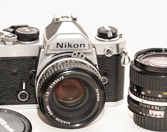 Nikon FM film camera with two Nikon lenses 50 mm f/1.8 and 28 mm f/3.5