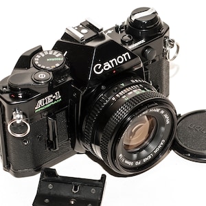 Canon AE-1 PROGRAM - black - film camera with lens 50 mm f/1.8