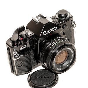 Canon A-1 film camera with lens 50 mm f/1.8 - EXCELLENT.