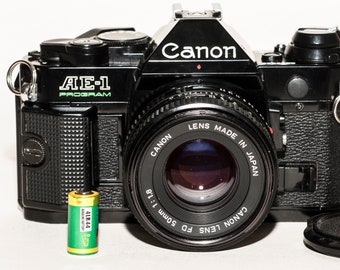 Canon AE-1 PROGRAM - ブラック - 50 mm f/1.8 レンズ付きフィルム