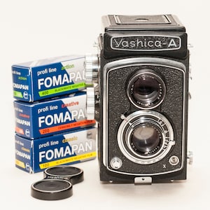 YASHICA A TLR 120mm film camera. with THREE new B&W 120 mm films 100/200/400iso - excellent.