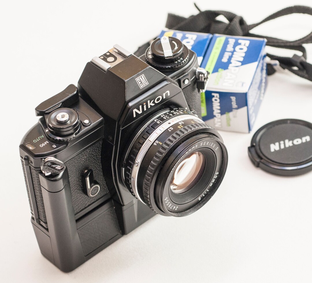 Nikon EM Film Camera With 50 Mm F1.8 SERIESE Lens and Nikon MDE Motor