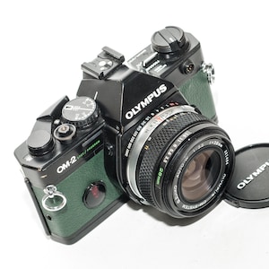 Olympus OM 2 SPOT PROGRAM with 28mm f/3.5 Zuiko lens - green khaki
