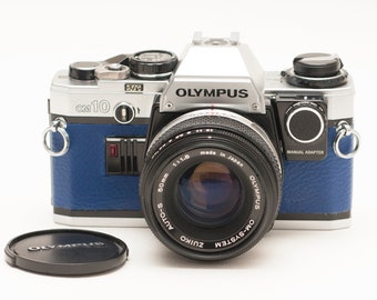 Olympus OM 10 with ZUIKO 50 mm f/1.8 lens and manual adapter - EXCELLENT.