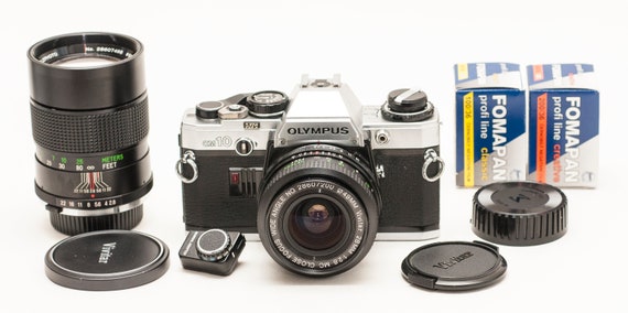Olympus OM 10 With Manual Adapter, Two VIVITAR Lenses 28 Mm Olympus OM 10 With Manual Adapter, Two VIVITAR Lenses 28 Mm
