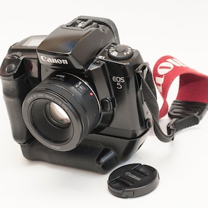Canon EOS 5 film camera with canon EF STM 50 mm F1.8 lens.