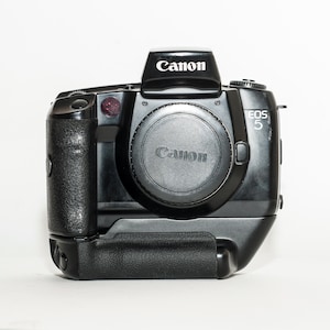 Canon EOS 5 film camera with canon VG 10 vertical grip.