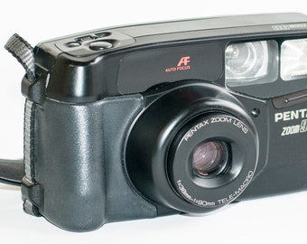 Pentax ZOOM 90 point and shoot 35 mm film camera.