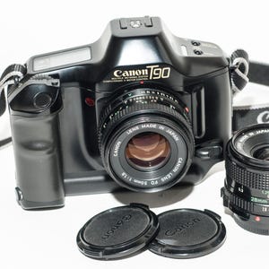 Canon T90 film camera with two Canon FD lenses 50 mm f1.8 and 28 mm f2.8