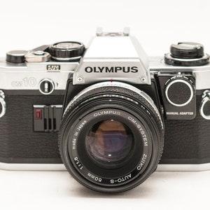 Olympus OM 10 with zuiko 50 mmf 1.8 lens and manual adapter.