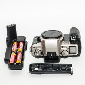 Canon EOS 50 E  AF camera body with BP-50 Canon battery pack.