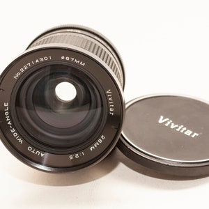 MINOLTA MD  fitting VIVITAR 28 mm f/2.5 wide angle lens.