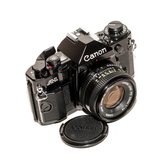 Canon A-1 フィルムカメラ 50mmレンズ付き Canon A-1 フィルムカメラ（50 mm f/1.8 レンズ搭載） - Etsy 日本