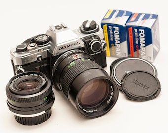 Olympus OM 10 with manual adapter, two VIVITAR lenses 28 mm f/2.8 135 mm f/2.8 Also two b&w FOMAPAN films.