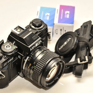 MINOLTA X700 with 50 mm f1.4 lens and strap two  b&w films 100/400iso.