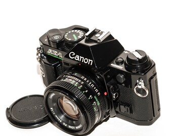 Canon AE-1 PROGRAM - ブラック - 50 mm f/1.8 レンズ付きフィルム