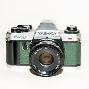 YASHICA FX-70 Quartz with 50 mm f/2 lens. New green skin refurbished.