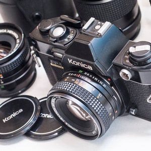 KONICA FP-1 PROGRAM film camera with three lenses 50 mm f1.8 28 mm f/3.5 and 135 mm f3.5