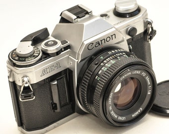 Canon AE-1 film camera with lens 50 mm f/1.8 and two FOMAPAN b&w films 100/200iso 36 frames.