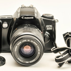 Canon EOS 3000 with 35-80 mm lens f4.5-5.6 III and original strap -EXCELLENT.