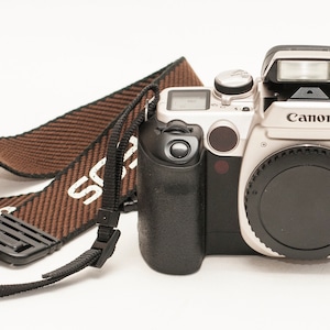 Canon EOS 50 E  AF camera body with original strap.