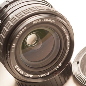 Praktica PB fitting SIGMA wide angle lens 28 mm F/2.8 - MINT.