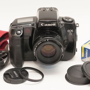 Canon EOS 5 film camera with canon EF 50 mm F1.8 II lens plus two fomapan films.