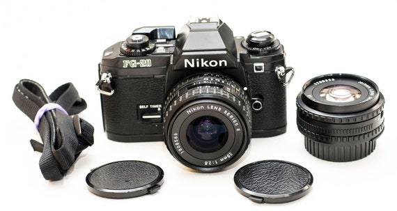 Nikon FG 20 Film Camera With 2 Lenses Set 50 Mm F 1.8 and 28 Nikon FG 20 Film Camera With 2 Lenses Set 50 Mm F 1.8 and 28