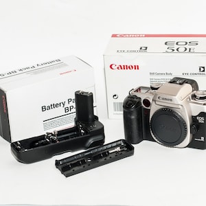 Canon EOS 50 E with Canon EF lens 35-80 mm F/4-5.6 III and 430EZ speedlite - New like in boxes - undamaged.