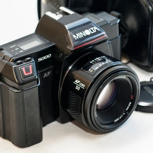 MINOLTA 5000 AF with 50 mm f1.7 MINOLTA lens and camera case.