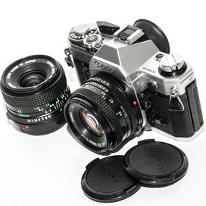 Canon AE-1 film camera with lenses 50 mm f/1.8 and 28 mm f/2.8 - EXCELLENT.